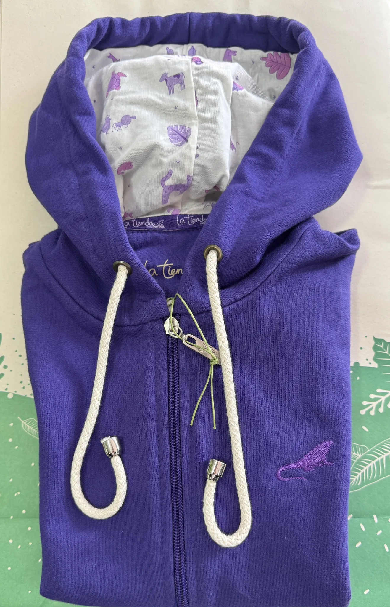 Buzo con cremallera y capota morado para niña